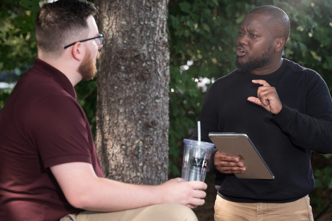 Two men talking