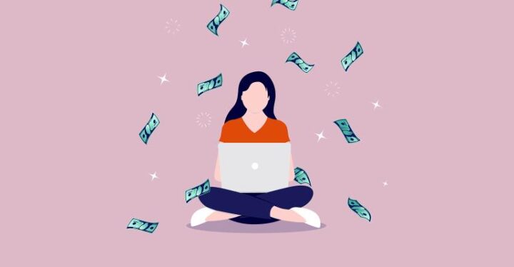 Woman laptop with money falling